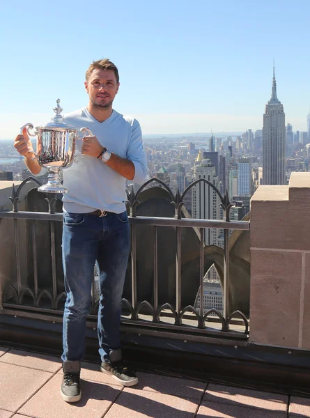 Three times Grand Slam champion Stanislas Wawrinka of Switzerland posing with US Open trophy on the Top of the Rock Observation Deck