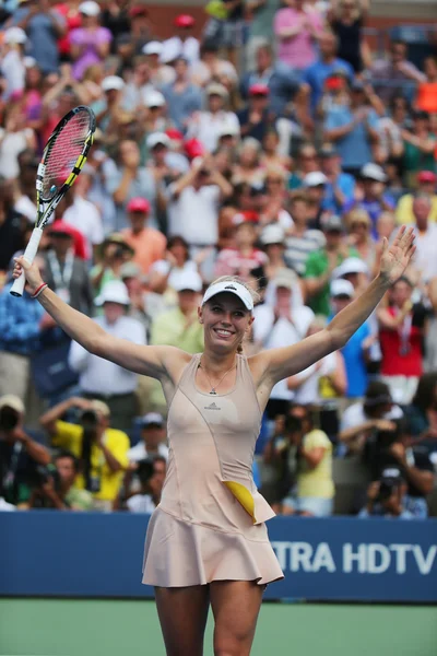 Professional tennis player Caroline Wozniacki celebrates victory after  third round match at US Open 2014