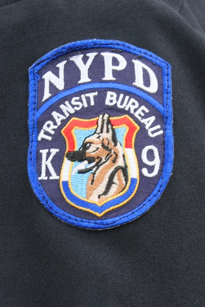 Close up of shoulder patch of NYPD Transit Bureau K-9 Unit