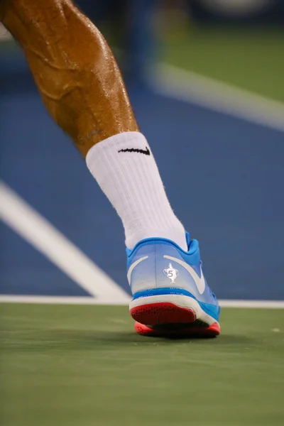 Seventeen times Grand Slam champion Roger Federer wears custom Nike tennis shoes during match at US Open 2014