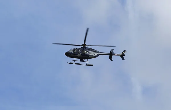 Bell 407 helicopter in the sky during New York City Marathon start