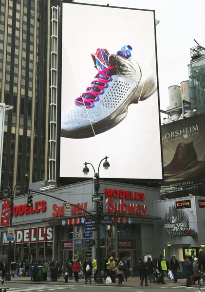 Jordan Flight Plate sneaker on billboard at Modell\'s \'s sport goods store in Manhattan