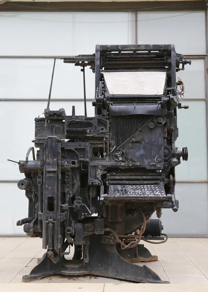 An old printing press machine being exhibited in the entrance of the Journalistic Center in Tel Aviv