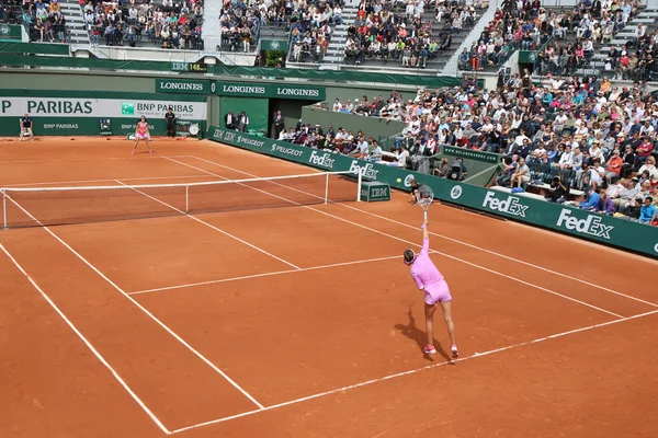 Professional tennis player Gilles Muller of Luxembourg in action during his second round match at Roland Garros