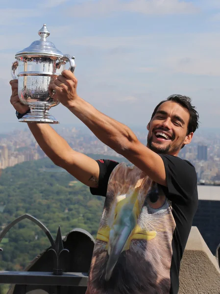 Professional tennis player Fabio Fognini posing with US Open trophy won by Flavia Pennetta on the Top of the Rock Observation Deck