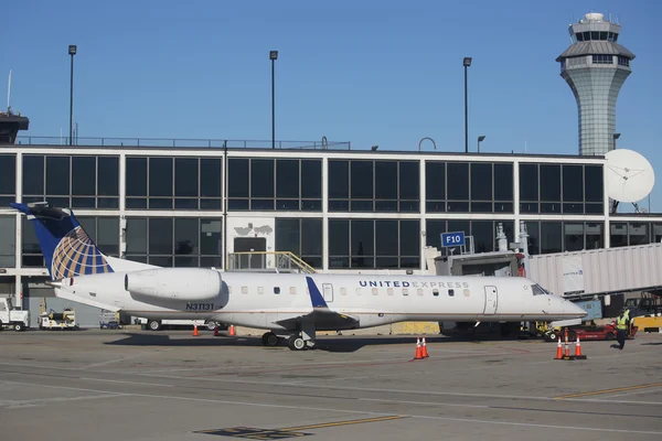 United Express Embraer plane on tarmac at O\'Hare International Airport in Chicago
