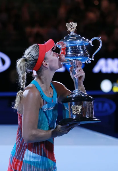 Grand Slam champion Angelique Kerber of Germany holding Australian Open trophy during trophy presentation after victory at Australian Open 2016