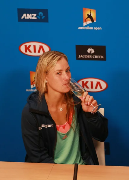 Grand Slam champion Angelique Kerber of Germany celebrates victory during press conference at Australian Open 2016