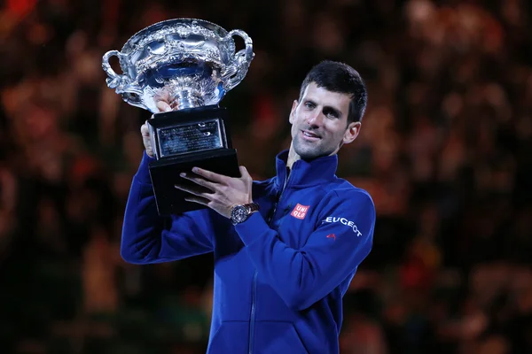 Grand Slam champion Novak Djokovic of Sebia holding Australian Open trophy during trophy presentation after victory at Australian Open 2016