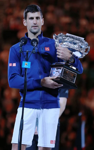 Grand Slam champion Novak Djokovic of Sebia holding Australian Open trophy during trophy presentation after victory at Australian Open 2016