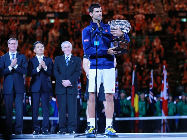 Grand Slam champion Novak Djokovic of Sebia holding Australian Open trophy during trophy presentation after victory at Australian Open 2016