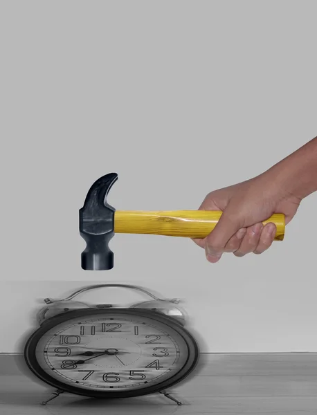 Hammer hitting Alarm Clock with motion blur
