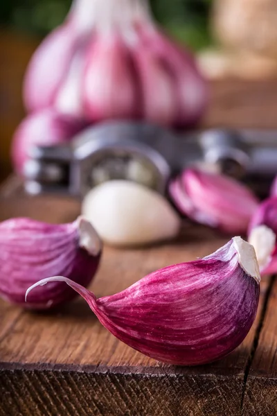 Garlic. Fresh garlic. Red garlic. Garlic press. Violet garlic.Garlic background. garlic bulbs