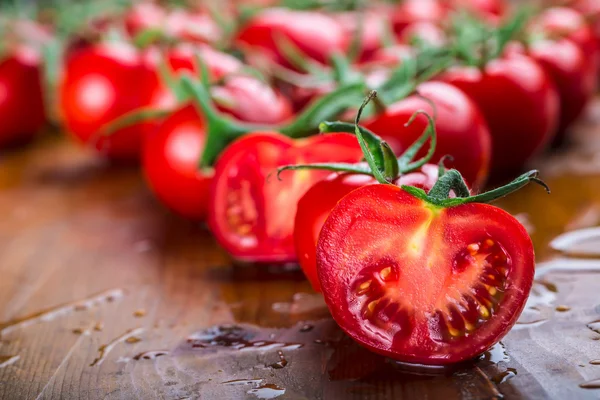 Fresh cherry tomatoes washed clean water. Cut fresh tomatoes