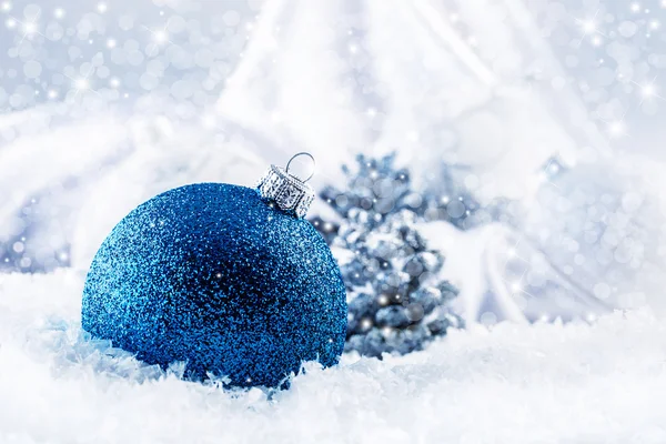 Luxury blue Christmas ball with ornaments in Christmas Snowy stil life. Christmas time