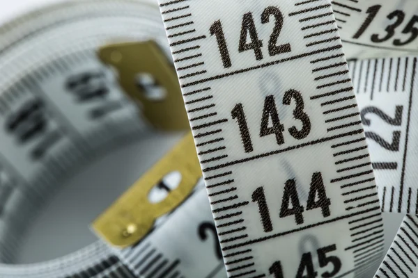 Curved measuring tape. Measuring tape of the tailor.