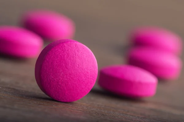 Pills. Tablets. Capsule. Heap of pills. Medical background. Close-up of pile of yellow green tablets - capsule. Pills and tablets