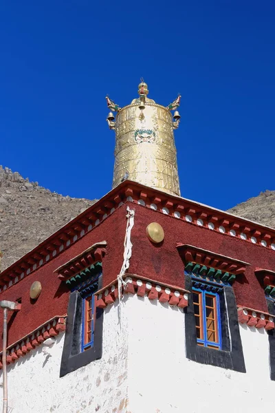 Gilded dhvaja-rooftop of red and white wall. Sera gonpa-Tibet. 1299