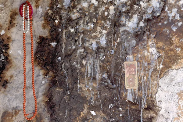 Religious offerings on cave wall. Drak Yerpa monastery-Tibet. 1512