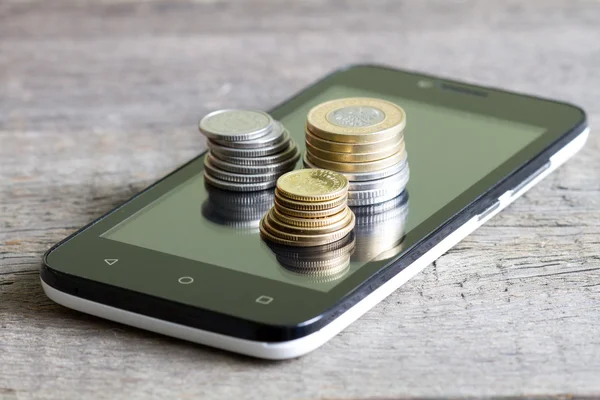 Cell phone and polish money closeup