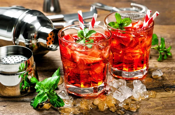 Red drinks with mint leaves and ice.