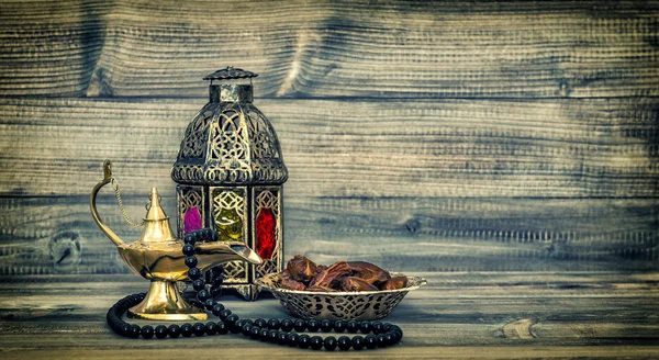 Arabic lantern and islamic rosary beads.