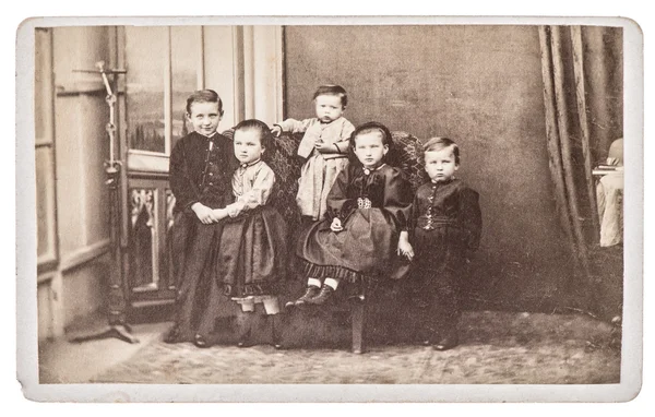 Old family photo with five children. brothers and sisters