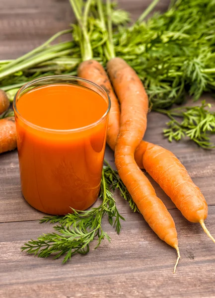 Carrot juice with fresh vegetables. Healthy food and drinks