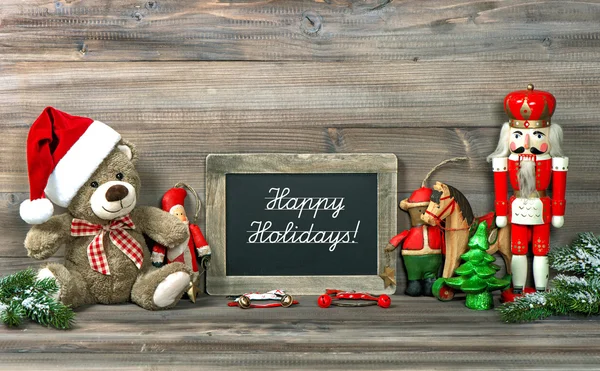 Christmas decoration with antique toys and blackboard