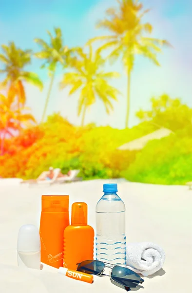 Sun protection creams,water and sunglasses