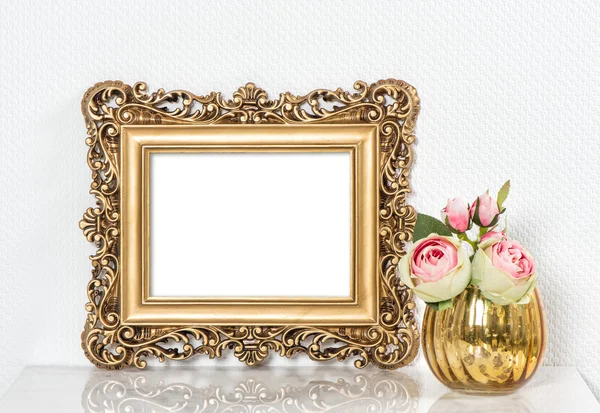 Baroque golden picture frame and rose flowers. Vintage style moc