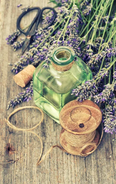 Lavender flowers bouquet with herbal oil and home tools. . Count