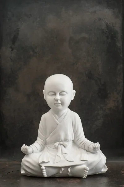 Praying buddha. White monk. Meditation and relaxing