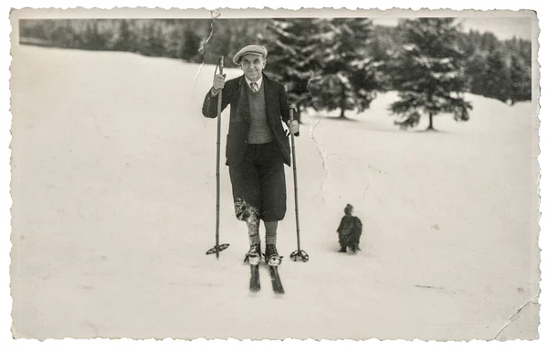 Vintage photo from skiing man in snow. Antique picture