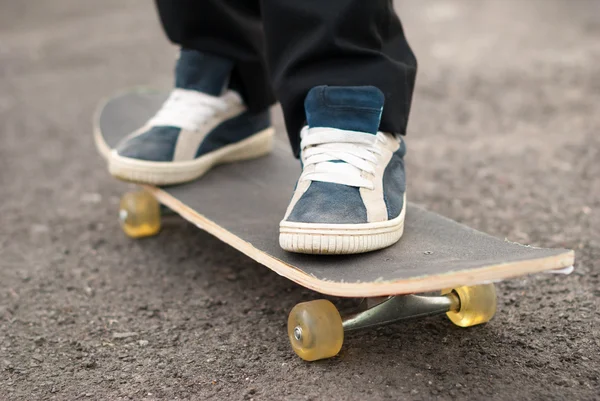 Skateboarder rides on the board.