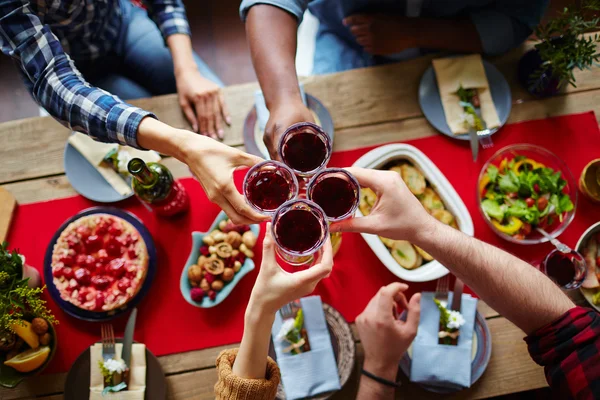 Friends toasting with red wine