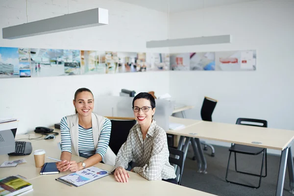 Happy colleagues at workplace