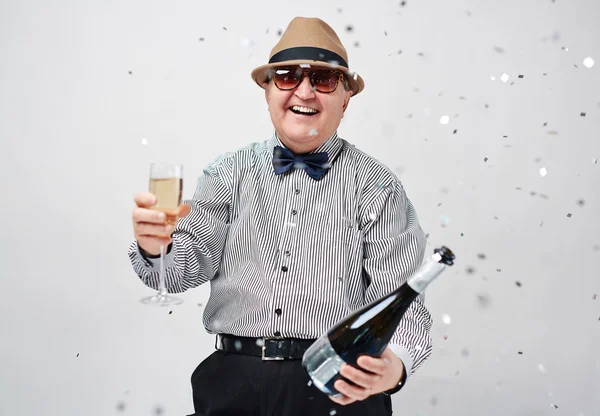 Laughing man toasting