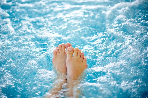 Female legs in hot tub