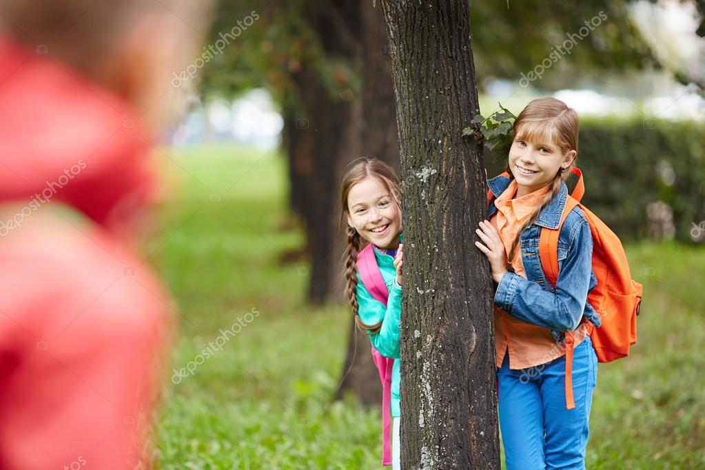 Schoolgirls in park - Stock Image Schoolgirls in park - Stock Image