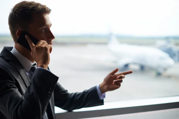 Business agent talking on phone