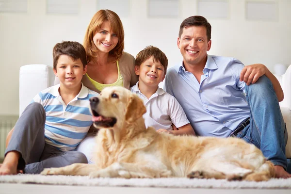 Family with Labrador dog