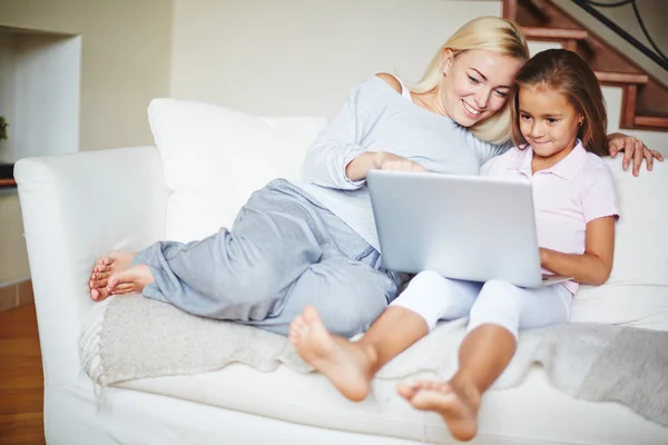 Mother and daughter with laptop