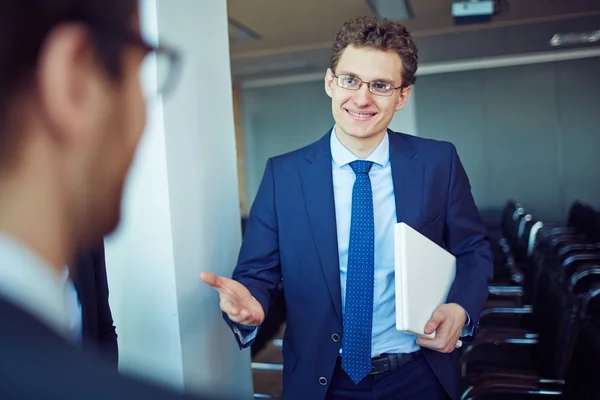 Elegant businessman  welcoming business partner