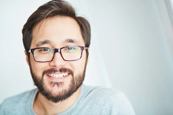 Asian man with beard in eyeglasses