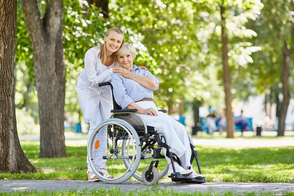 Nurse with senior patient in a wheelchair