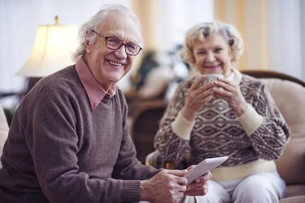 Aged couple with touchpad