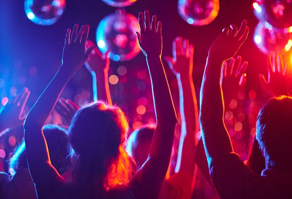 Crowd of people  dancing in night club