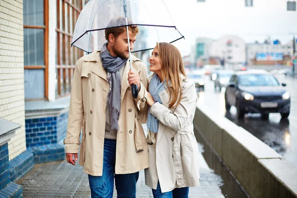 Beautiful couple under the rain