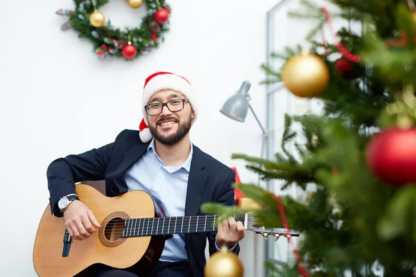 Businessman playing Christmas song